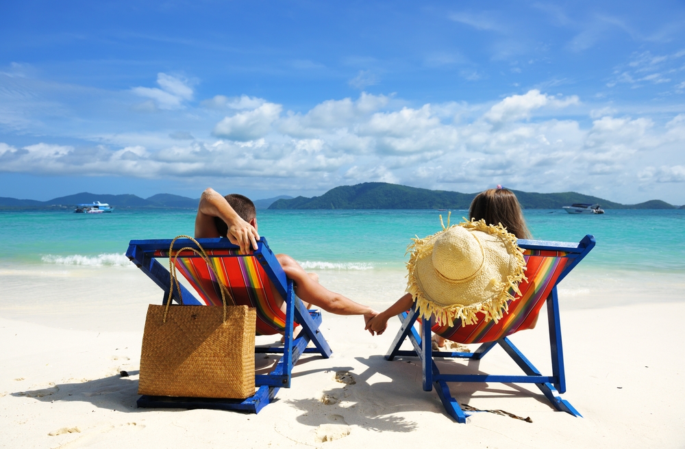 Couple sitting on a Phuket Island Beach